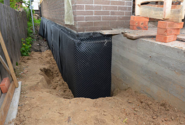 Happy homeowners after waterproofing job in Bourbon